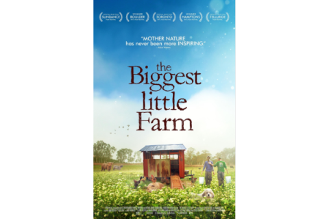 Movie Poster. The biggest little Farm. Red shed in a field with animals.